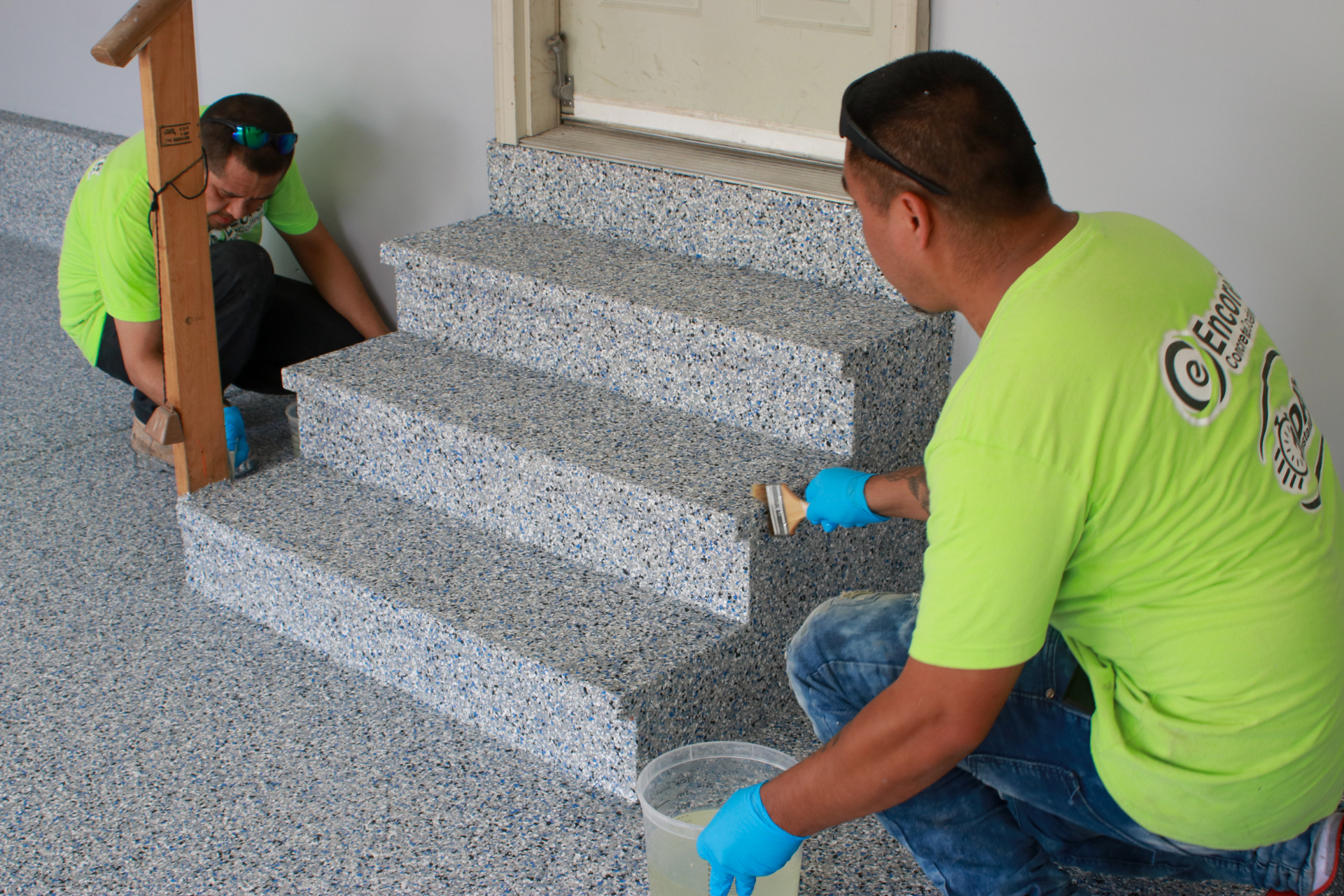 Encore crew installing a concrete coating floor
